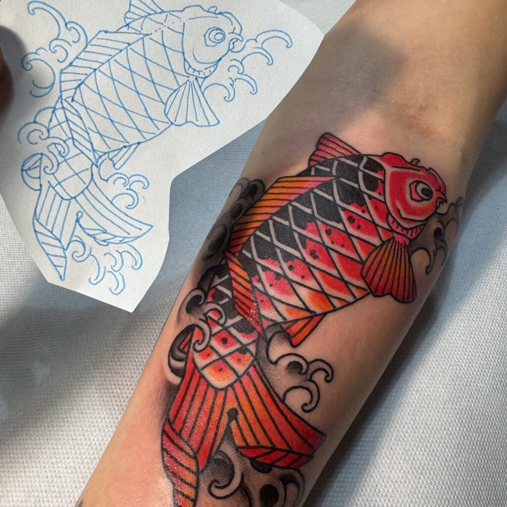 A colour Japanese-style koi tattoo on a forearm next to its blue stencil drawing