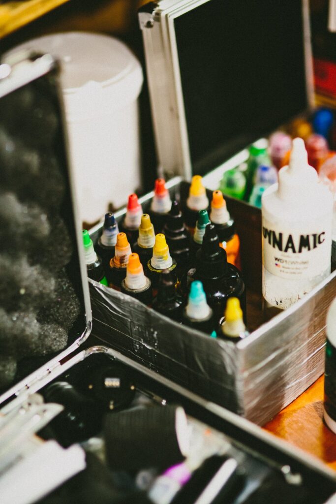 Bottles of tattoo ink in a metal case